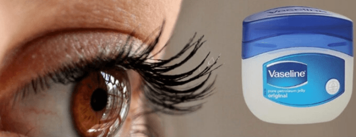 A close-up of an eye with long lashes beside a jar of Vaseline original petroleum jelly
